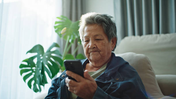 istock Elderly relax talking with ai voice assistant, chatbot. 2202817965