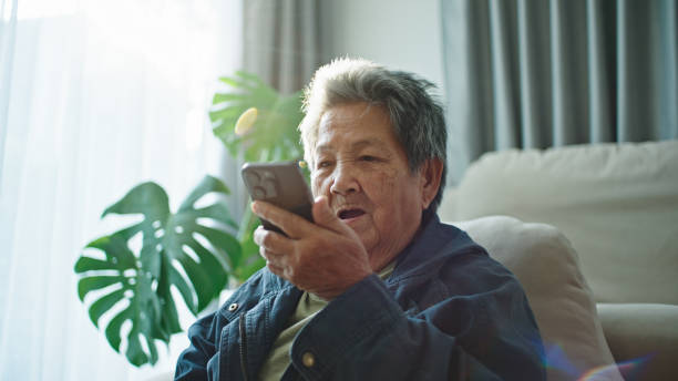 istock Elderly relax talking with ai voice assistant, chatbot. 2202817967