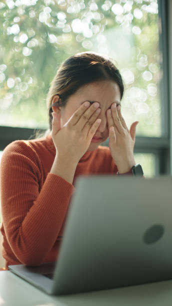 istock Businesswoman headache and stress while working. 2202818081