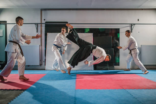 istock A small group of young fighters in kimonos are fighting 2202818154