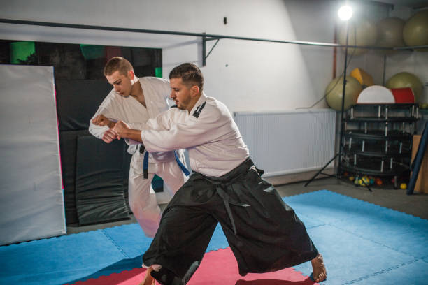 istock A young fighter fights with a skilled aikido master in the gym 2202818211