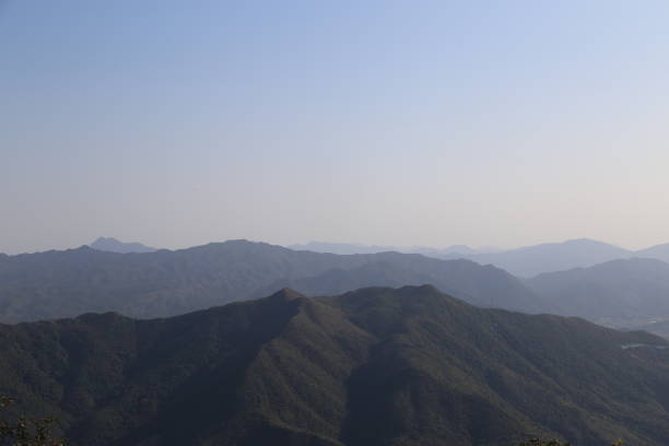 istock The mountains are covered in trees and the sky is clear 2202819312