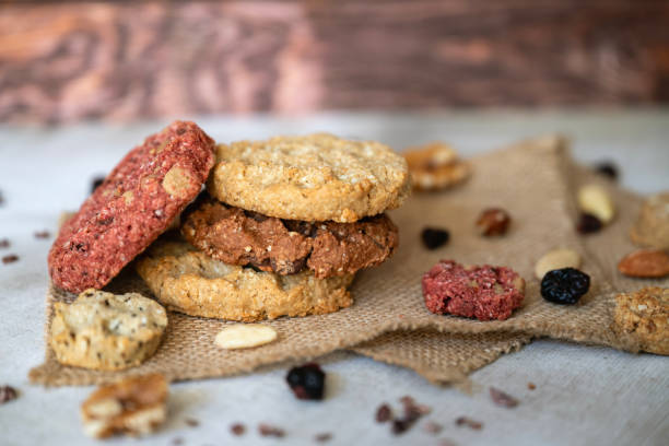 istock Oat cookies with  nuts and seeds on shadows background 2202820420