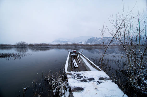 Small boats moored in the river in winter