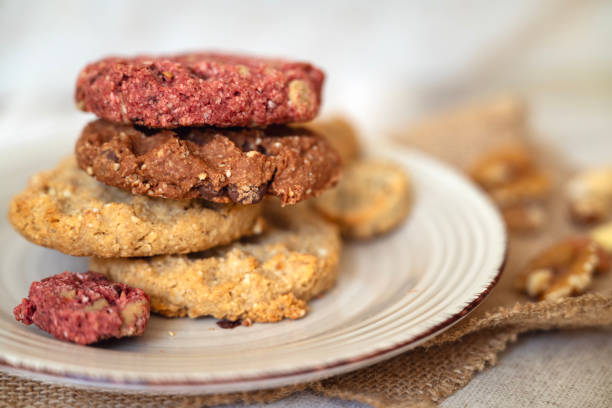 Oat cookies with  nuts and seeds on shadows background