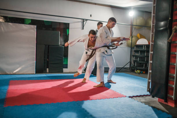 istock A group of fighters learn self-defense during aikido training 2202821746