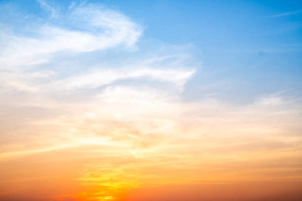 istock Beautiful , luxury soft gradient orange gold clouds and sunlight on the blue sky perfect for the background, take in evening,Twilight, Large size, high definition landscape photo 2202822585