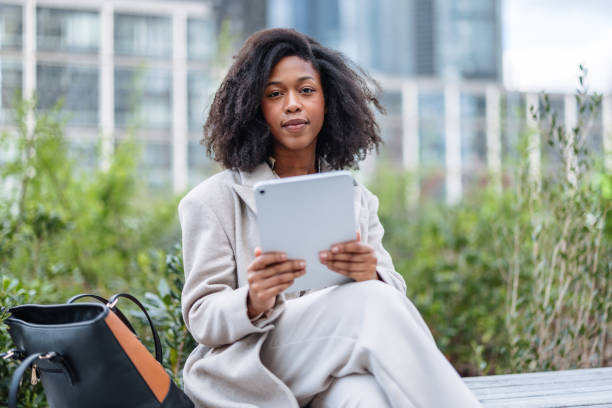 istock Cheerful Young Black Businesswoman Using Digital Tablet Outside Office 2202823968