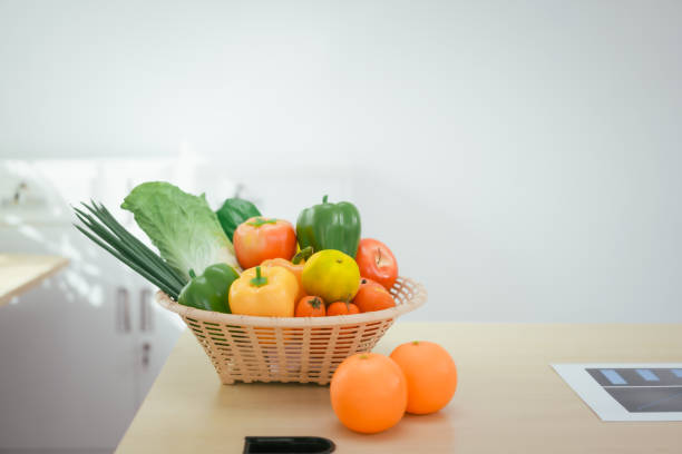 leaders and vegetables in a bowl and on a wooden table, colorful, in the kitchen