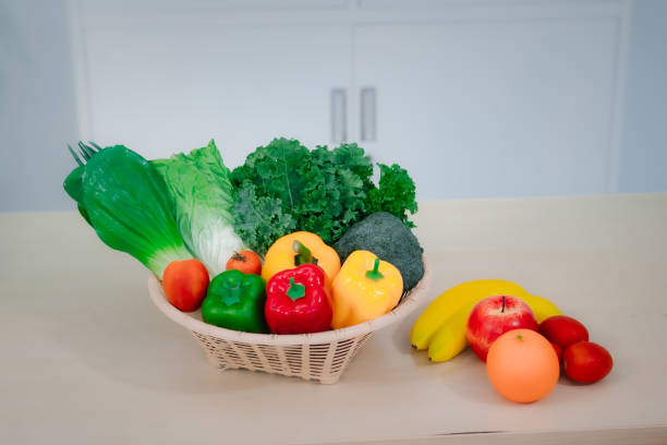 A vegetable and fruit basket placed on a table, promoting healthy eating, weight loss, and balanced nutrition, representing a natural and fresh lifestyle with no people in the scene