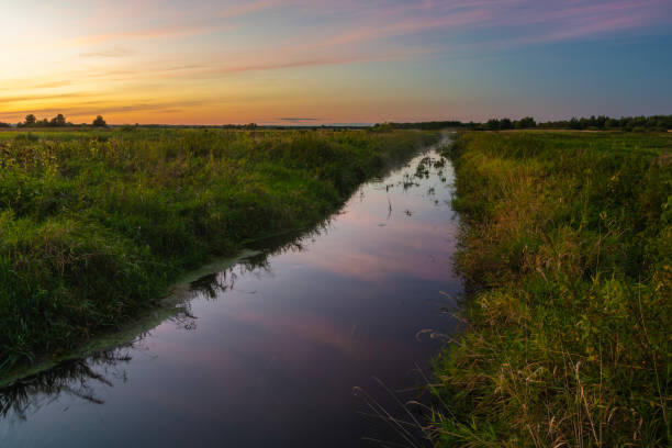 istock A view of a small, quiet river during sunset, Czulczyce, Poland 2202824198