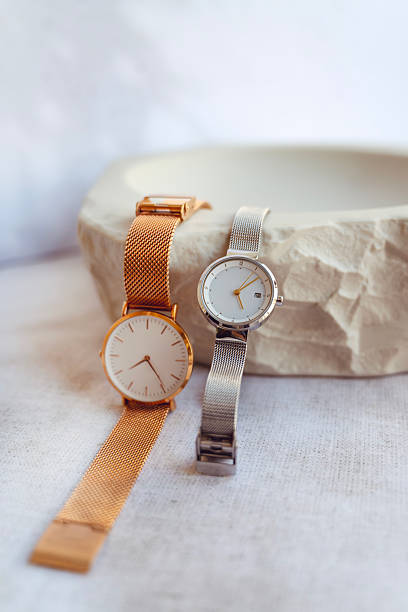 istock Silver and Golden watches in stone tray 2202825604
