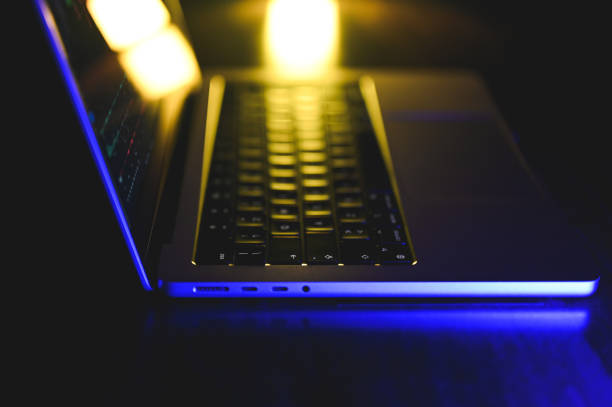 istock Laptop on desk in darkroom. 2202829186