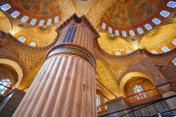 istock interior of mosque, ceiling, domes are painted with patterns, decorative windows and columns, chandeliers, beautiful architecture of Islamic religion, Istanbul, Turkey 2202830695