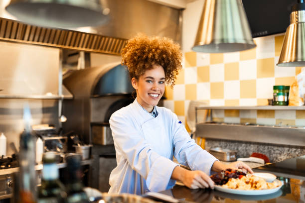 istock Talented Female Chef Proudly Holding a Freshly Prepared Plate 2202831958