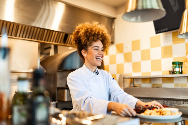istock Professional Woman Chef Showcasing Her Culinary Creation 2202831998