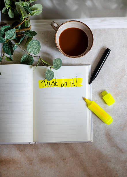Book marked by sticky note.