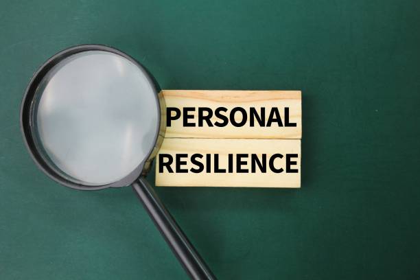 istock magnifying glass and stick with the words Personal Resilience 2202833692