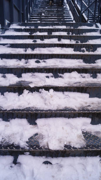 istock snow and ice covered stairs 2202834915