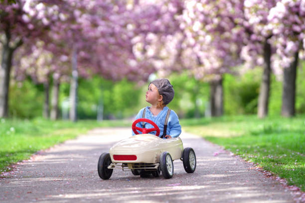 istock playing in the blooming park in spring season 2202835145