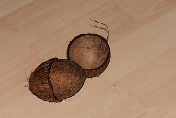 Coconut on a wooden background. Close-up, selective focus