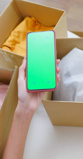 istock Woman Unpacks with Smartphone 2202842383