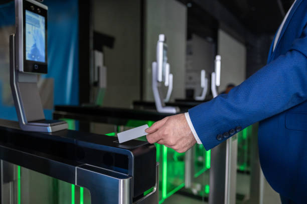 istock Close up picture of male hand with an access card on a security control 2202846821