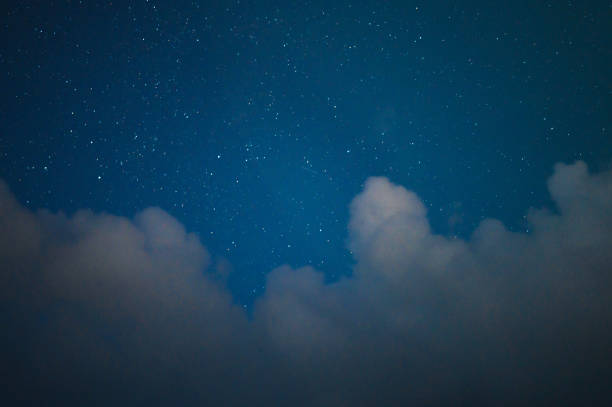 High-resolution night sky showcasing a vast array of stars against a deep blue backdrop. This tranquil scene illustrates the beauty of rural Thailand, where the sky offering perfect conditions for stargazing and astrophotography.