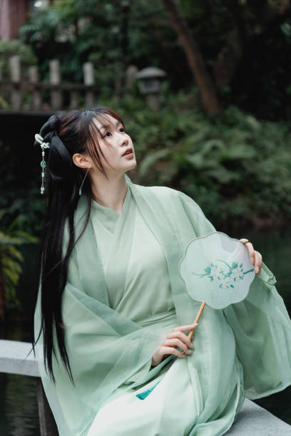 istock Hanfu Lady Gazing into the Distance on an Ancient Bridge. 2202849369