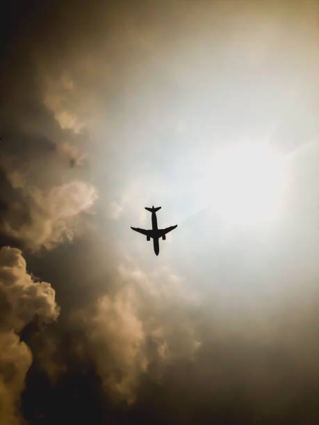 istock Silhouette,Of,Aircraft,Are,Landing 2202852608