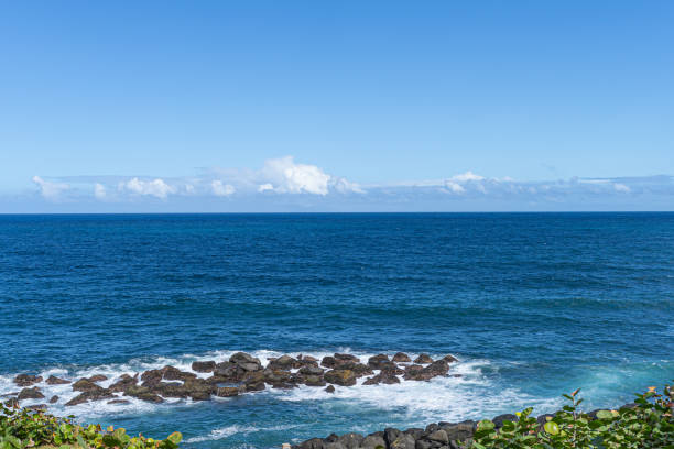 Rocks on ocean sea shore in with clouds