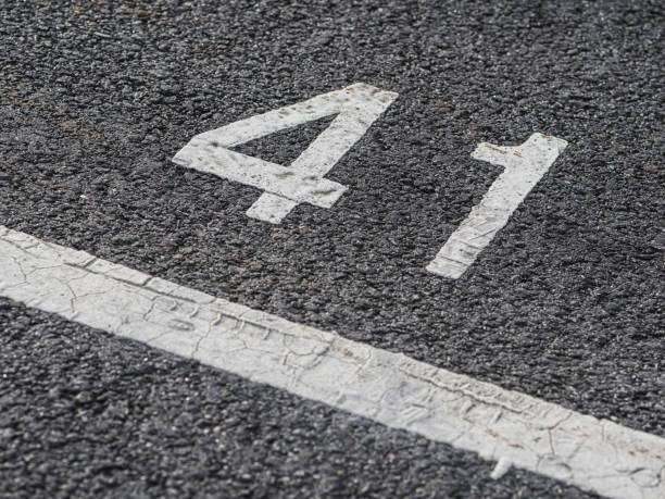 istock Parking number 41 marked on the asphalt surface in a public lot during daylight hours 2202853797