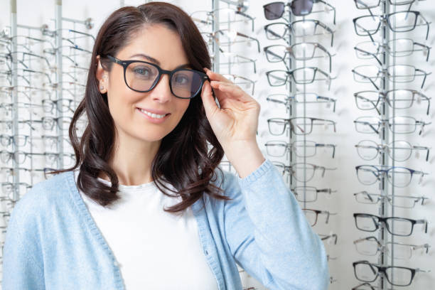 istock Smiling young dark-haired woman in eyeglasses looking contented 2202854028