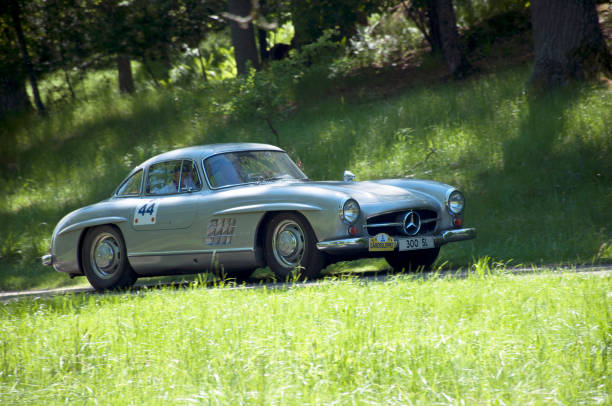 Stockholm, Sweden - June 5 , 2022: A  grey Mercedes-Benz 300SL Gullwing racing on the tracks around Djurgården during Gärdesloppet in Stockholm, Sweden.