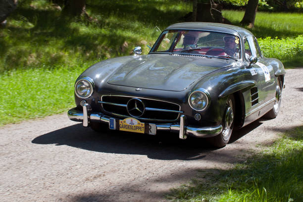 Mercedes-Benz 300SL Gullwing from 1955 Stockholm, Sweden - June 6 , 2022: A grey Mercedes-Benz 300SL Gullwing racing on the tracks around Djurgården during Gärdesloppet in Stockholm, Sweden. 1950s racing car stock pictures, royalty-free photos & images