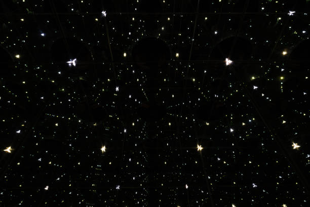 istock Mysterious abstract background with shimmering points of light, creating an illusion of an infinite starry space in the night sky. 2202864551
