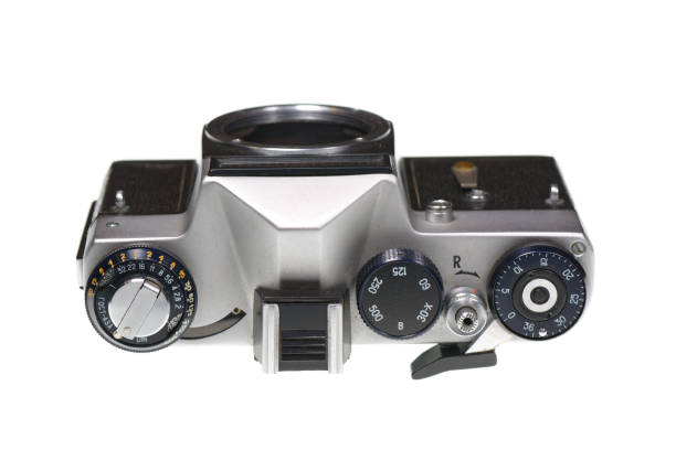 Old soviet analog 35 mm film camera without a lens isolated on white background