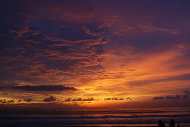 istock beautiful sunset with red glowing sun in the horizon 2202865591