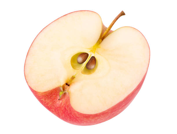 istock Half of red apple with seeds isolated on white background 2202865866