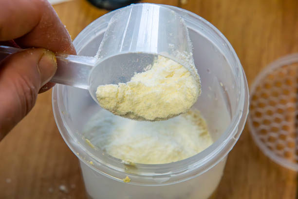 istock protein and carbohydrate cocktail preparation using a shaker. Dietary activity. healthy lifestyle, healthcare nutrition concept. protein powder. 2202865890