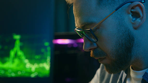 istock Concentrate Caucasian man trader businessman addict typing keyboard pc computer at home neon agent freelancer working crypto stock male broker writing worker guy developer planning business at night 2202867798