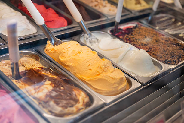 display case in a cafe with different types of gelato ice cream in italy - ジョグジャカルタ 食事 ストックフォトと画像