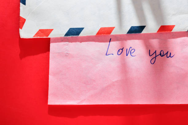 Opened envelope letter with handwritten English words LOVE YOU ,love , friendship and happiness