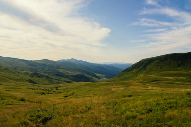 Sunrise dawn in scenic view in mountains against cloud sky, Wonderful picturesque autumn background. Beautiful colors and a peaceful atmosphere around Full Frame, Ambient Light, Copy Space