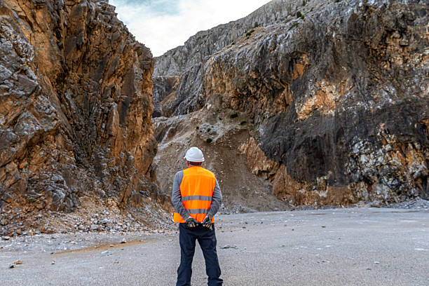 istock Engineer working in stone quarry, performing analysis. Industry and Business. 2202869007