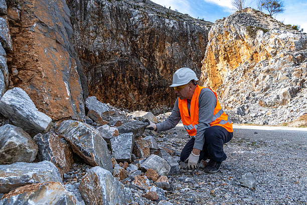 istock Engineer working in stone quarry, performing analysis. Industry and Business. 2202869651