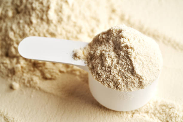 istock Whey protein powder in a white measuring spoon 2202872468
