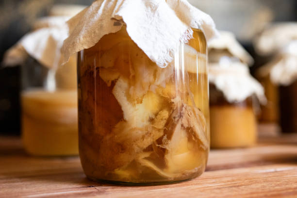 istock Homemade fermented kombucha tea with scoby- full process Kombucha tea making process 2202873298