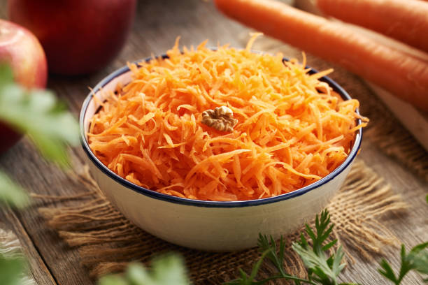 istock Fresh carrot salad in a bowl, closeup 2202875309