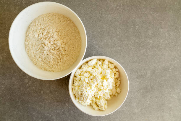 istock cottage cheese and flour in white bowls on kitchen counter 2202876476